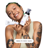 A person with tattoos smiles broadly, holding a tube of Aftercare Cream and a bottle of Aftercare Foam Cleanser from the brand "STORIES & INK." The person wears a sleeveless top, and the text below reads, "Combine for better results."